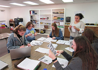 Students working as group at desk