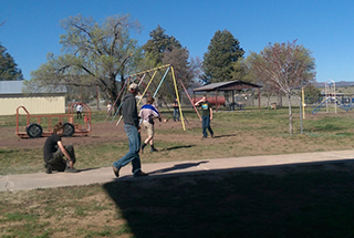 Students playing on playground equipment