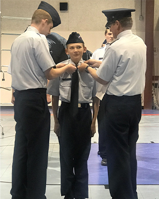 JROTC student receiving pin