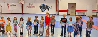 Students reading picture book together