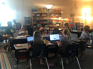 Students working on laptop computers